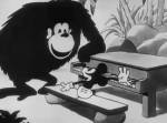 Still from 'The Castaway' featuring Mickey at the piano and a great ape